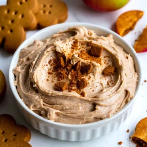 - 8 oz cream cheese, softened - 1/2 cup powdered sugar - 1/2 cup sour cream - 2 teaspoons ground ginger - 1 teaspoon ground cinnamon - 1/4 teaspoon ground nutmeg - 1/4 teaspoon ground cloves The main ingredients create a creamy base. Cream cheese gives the dip that rich texture. Powdered sugar adds sweetness without being gritty. Sour cream balances the richness and adds a slight tang. The spices bring warmth and flavor, perfect for the holidays. Ginger, cinnamon, nutmeg, and cloves give the dip its festive taste. - 1/4 cup molasses - 1/2 cup whipped topping - Gingerbread cookies, for dipping - Apple slices, for dipping - Crushed ginger snaps, for garnish Molasses adds depth and a hint of sweetness. Whipped topping makes the dip light and fluffy. For dipping, gingerbread cookies are a classic choice. They pair well with the dip's flavors. Apple slices bring freshness and crunch. Crushed ginger snaps on top add texture and a fun crunch. This combination makes your dip a festive treat! {{ingredient_image_2}} 1. Start with 8 oz of cream cheese. Make sure it is soft. Place it in a large bowl. 2. Using an electric mixer, beat the cream cheese until it is smooth and creamy. This step is key for a good dip. 3. Next, add 1/2 cup of powdered sugar and 1/2 cup of sour cream. Mix them well. Keep blending until no lumps remain. 1. Now it&rsquo;s time to add flavor. Pour in 1 teaspoon of pure vanilla extract. 2. Then, mix in 2 teaspoons of ground ginger, 1 teaspoon of ground cinnamon, 1/4 teaspoon of nutmeg, and 1/4 teaspoon of ground cloves. Stir everything until well combined. 3. Slowly drizzle in 1/4 cup of molasses. This will make your dip sweet and rich. Mix until it is smooth and fluffy. 4. Carefully fold in 1/2 cup of whipped topping. Use a spatula and be gentle. This keeps your dip light and airy. 1. Once mixed, transfer the dip to your serving bowl. Use a spatula to smooth the surface. Make it look nice and inviting. 2. Cover the bowl with plastic wrap. Place it in the fridge for at least 30 minutes. This chilling time helps the flavors blend well. 3. Before serving, sprinkle crushed ginger snaps on top. This adds crunch and makes it more appealing. - Ensuring cream cheese is softened: Make sure your cream cheese is at room temperature. This helps it mix easily for a smooth dip. - How to achieve the perfect dip texture: Mix all ingredients well to avoid lumps. The dip should be fluffy, creamy, and easy to scoop. - Best accompaniments for dipping: Serve with gingerbread cookies and fresh apple slices. They add a nice crunch and sweetness. - Presentation ideas for gatherings: Use a decorative bowl and arrange the cookies and apple slices around it. Top with crushed ginger snaps for a festive look. Pro Tips Use Room Temperature Cream Cheese: Ensure your cream cheese is softened to room temperature for a smoother dip. Cold cream cheese can lead to lumps that are difficult to blend. Chill for Flavor Integration: Allow the dip to chill in the refrigerator for at least 30 minutes before serving. This resting time helps the flavors meld together for a more delicious taste. Custom Spice Adjustments: Feel free to adjust the spices according to your preference. If you love ginger, add a bit more ground ginger for a spicier kick. Garnish Creatively: Besides crushed ginger snaps, consider garnishing with a sprinkle of cinnamon or a drizzle of caramel for added visual appeal and flavor contrast. {{image_4}} You can make this dip even better! Try adding chocolate or caramel for a sweet twist. Just swirl in some melted chocolate or drizzle caramel on top. Both add a rich taste that contrasts nicely with the spices. Using alternative sweeteners can help too. If you want less sugar, try stevia or monk fruit. These options keep the flavor but lower the calories. Just adjust the amount based on the sweetener&rsquo;s strength. If you need a gluten-free option, use gluten-free gingerbread cookies for dipping. There are many brands available that taste great. This way, everyone can enjoy the dip. For a vegan adaptation, swap the cream cheese for a plant-based option. You can use cashew cream or coconut cream instead. Make sure to pick a vegan whipped topping too. This keeps the dip creamy while being plant-based. To store leftover dip, first scoop it into a clean container. Use a tight lid to keep it fresh. This helps avoid any odors from your fridge. The best containers for refrigeration are glass or plastic. Make sure they are airtight. This keeps your dip creamy and tasty for later use. The dip stays fresh in the refrigerator for about 3 to 4 days. Always check for any changes in smell or texture before eating. If you want to freeze the dip, it can last up to 2 months. Make sure to use a freezer-safe container. When ready to eat, thaw it in the fridge overnight. Stir well before serving to restore its creamy goodness. Can I use low-fat cream cheese? Yes, you can use low-fat cream cheese. It will change the taste and texture a bit. The dip may be less rich, but it will still taste good. Just make sure it is softened to mix easily. How long should I chill the dip? Chill the dip for at least 30 minutes. This time helps the flavors blend well. If you can wait longer, the dip will taste even better. Can I make this dip ahead of time? Yes, you can make this dip a day ahead. Just cover it well and keep it in the fridge. This helps the flavors develop more. What are the best substitutes for molasses? If you don&rsquo;t have molasses, you can use honey or maple syrup. They will give a sweet taste but will change the flavor slightly. Brown sugar mixed with a bit of water can work too. This blog post covered how to make a delicious dip using easy ingredients. We talked about the main and additional ingredients, like cream cheese and spices. You learned steps for preparation and flavor mixing, plus pro tips for the best results. We also explored tasty flavor tweaks and storage tips to keep your dip fresh. In the end, you can create a dip that everyone will love. Enjoy sharing it at your next gathering!